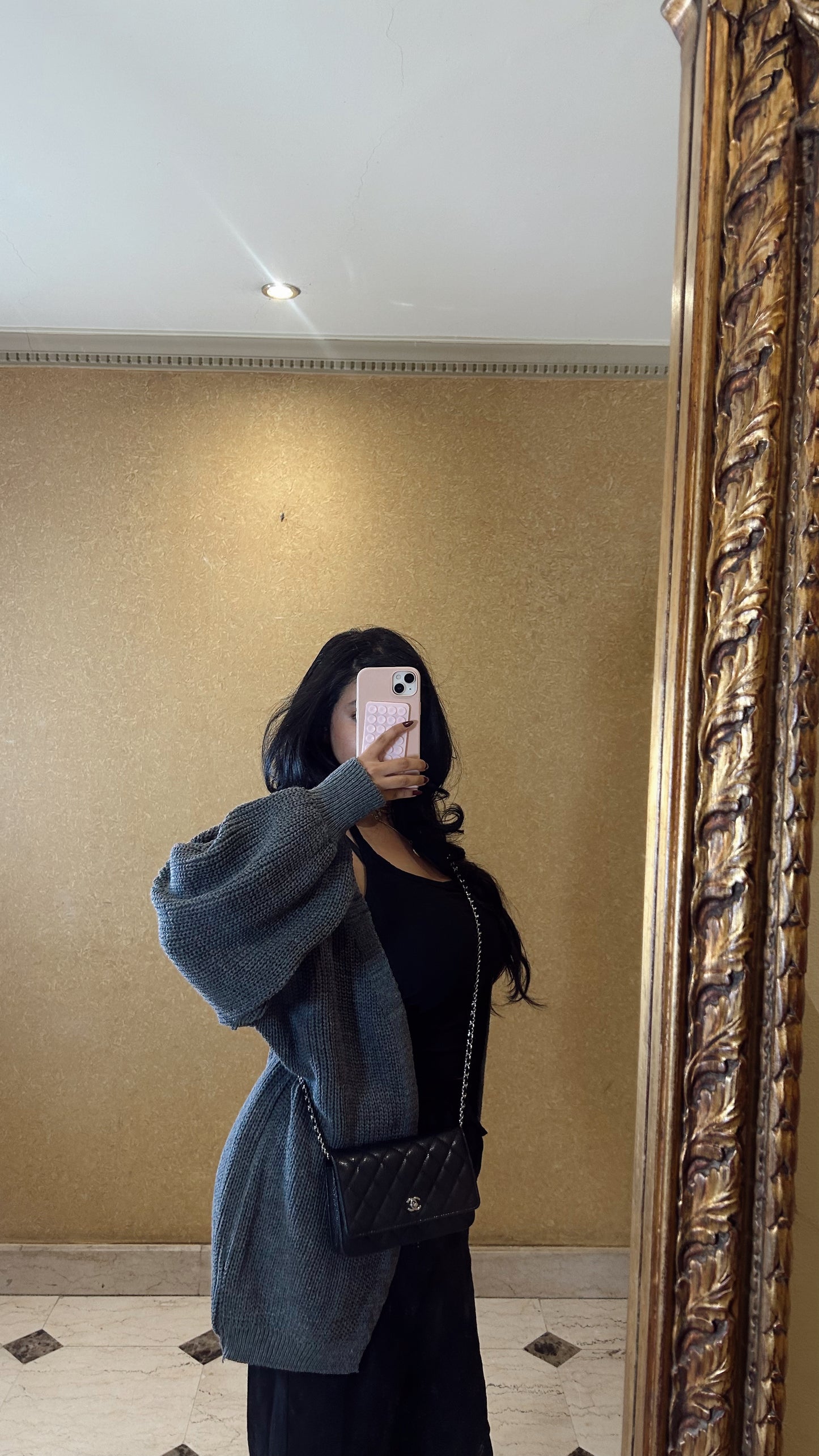 the dark grey short cardigan