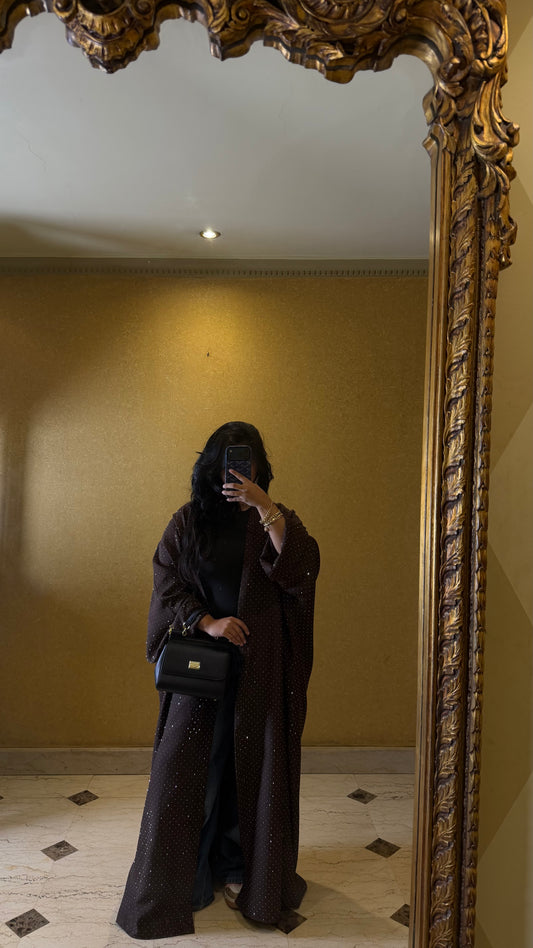 the dark brown abaya